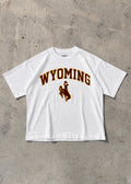 White | White t-shirt with 'Wyoming' and a logo on a concrete floor