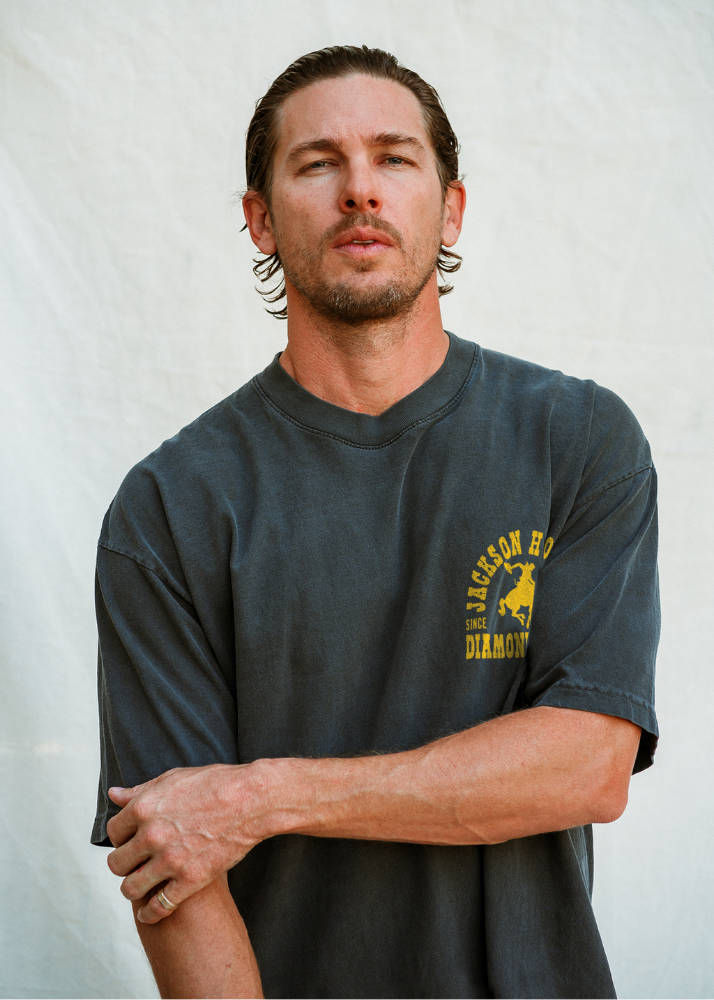 Sun Faded Black & Rodeo Gold | Buckin Tee